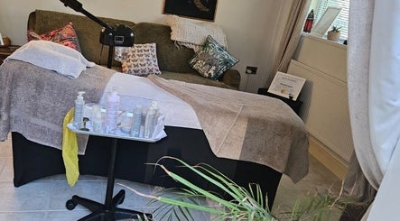 Tranquil treatment room at ELM Skin & Brows, Llantwit Major, Wales, GB, featuring a comfortable therapy bed.