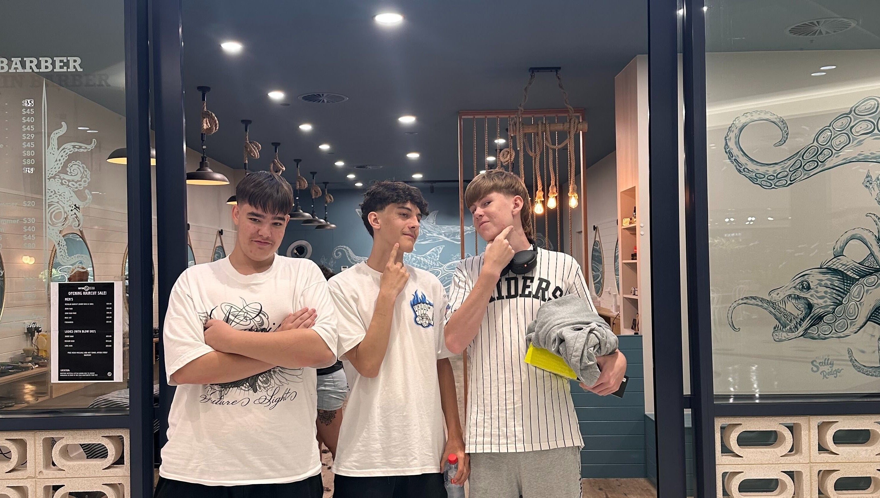 Three young men stand confidently outside Captain Barber - Whitford, Hillarys, Western Australia, AU.