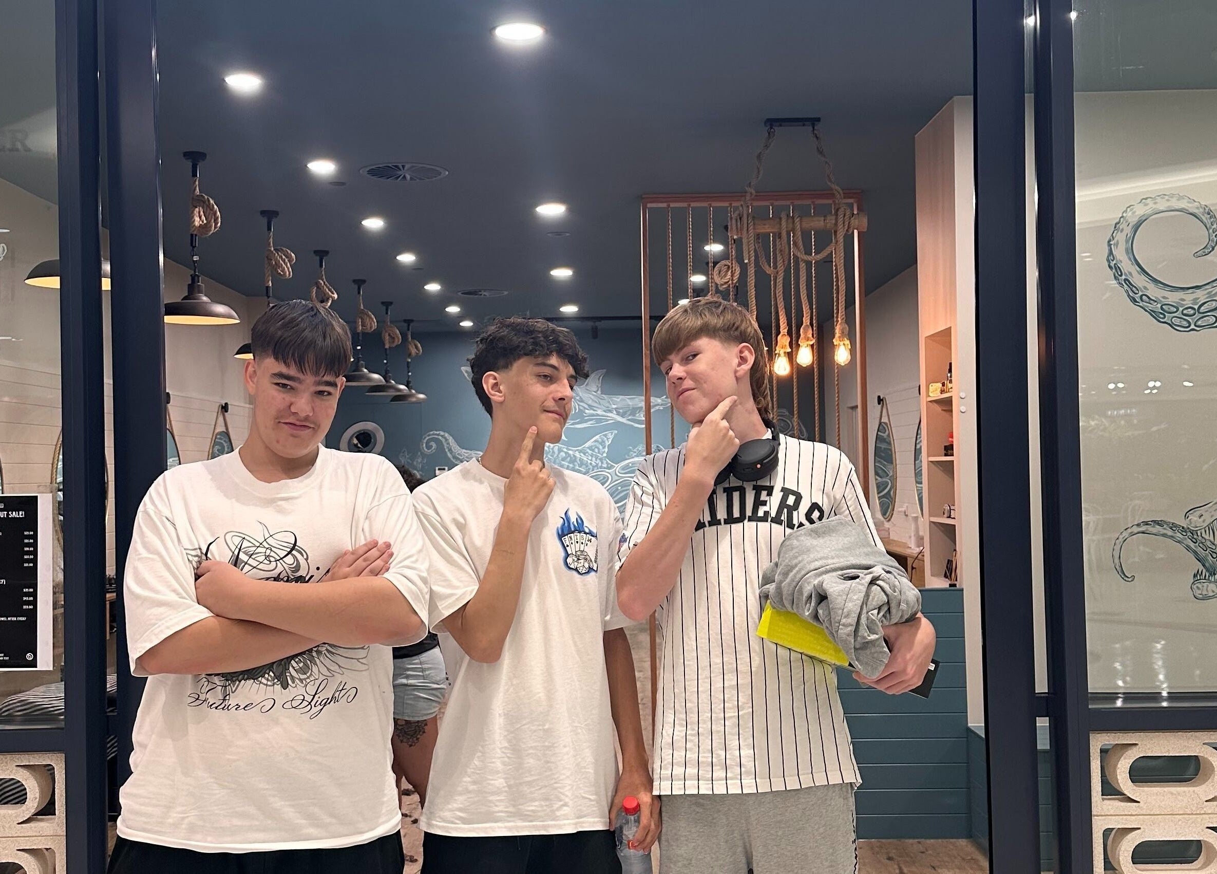 Three young men stand confidently outside Captain Barber - Whitford, Hillarys, Western Australia, AU.
