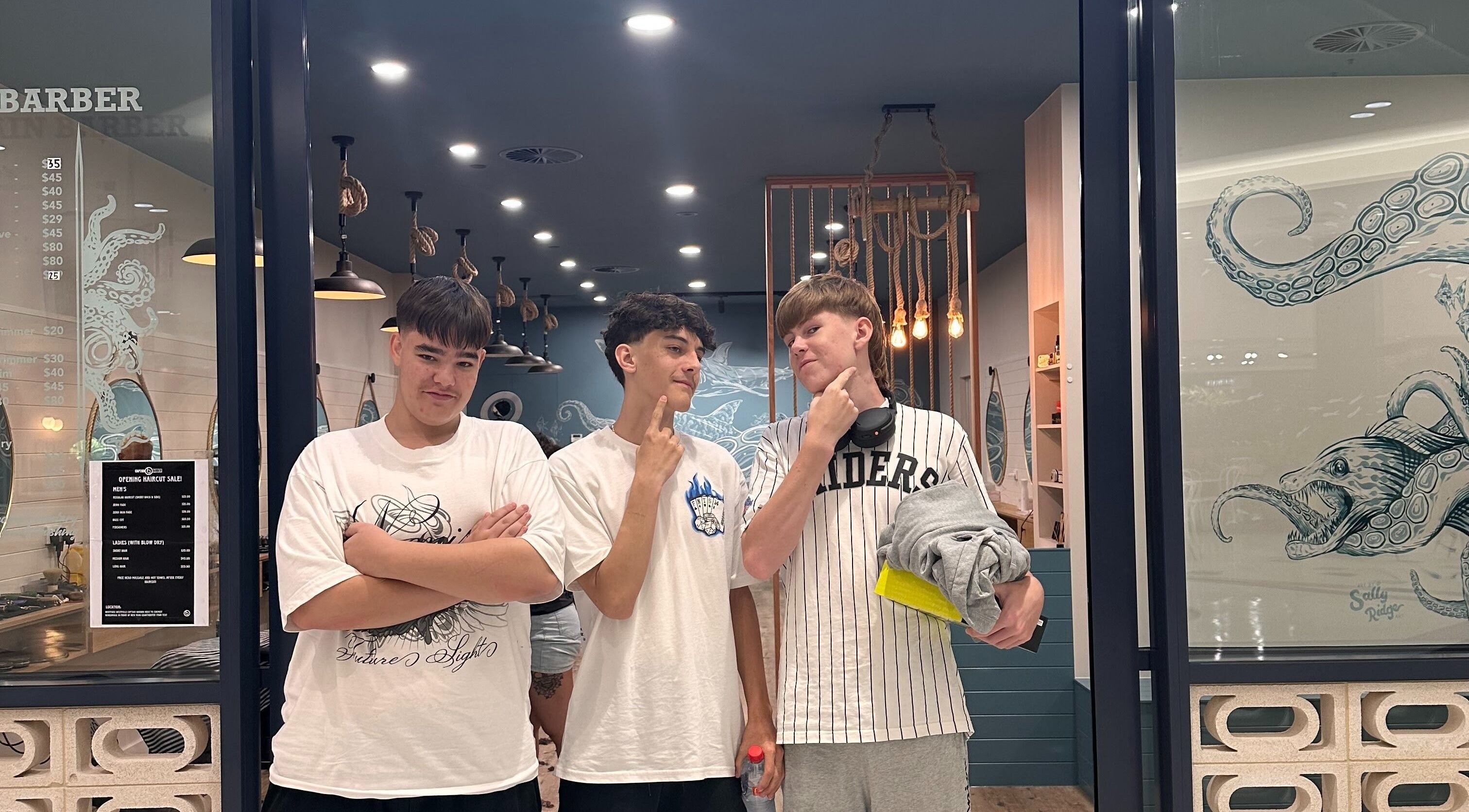 Three young men stand confidently outside Captain Barber - Whitford, Hillarys, Western Australia, AU.