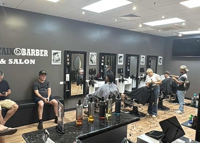 Interior view of Captain Barber Oasis in Palmerston City, Northern Territory, AU showcasing stylish haircuts.