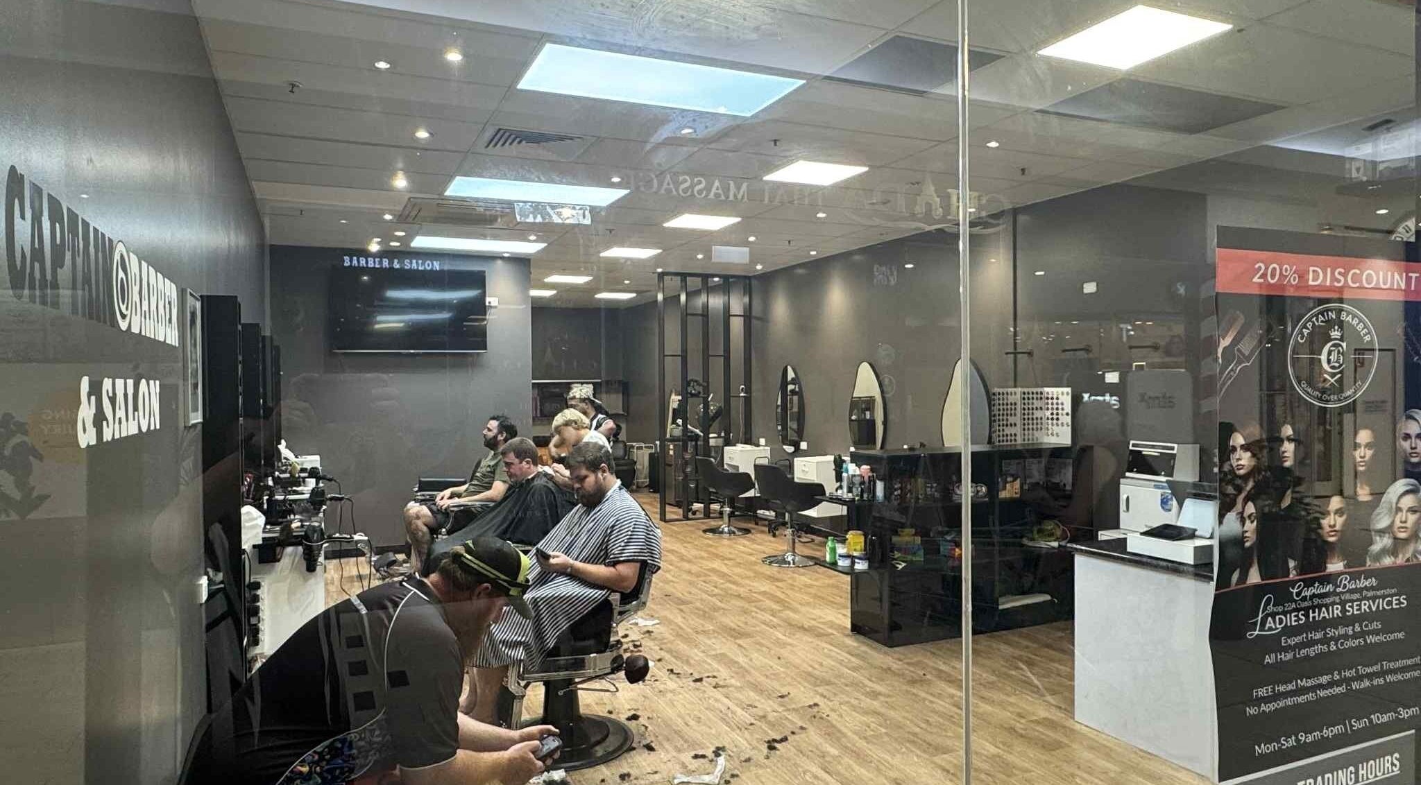 Interior of Captain Barber Oasis in Palmerston City, Northern Territory, AU showcasing modern salon layout.