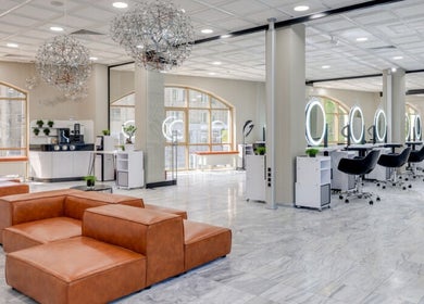 Modern interior of Jio Hair Care, Ahmedabad, Gujarat, IN with stylish seating and salon stations.