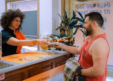 Receptionist assisting visitor at Remedial Massage & Spa Centre, North Richmond, New South Wales, AU.