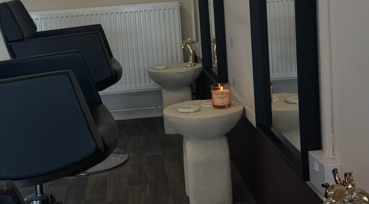 Elegant salon interior at Brushed By Amelia, featuring chic seating and decor in Milford Haven, Wales, GB.