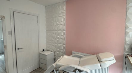 Relaxing treatment room at Studio1_byJordan in Featherstone, England, GB with modern decor and comfortable chair.