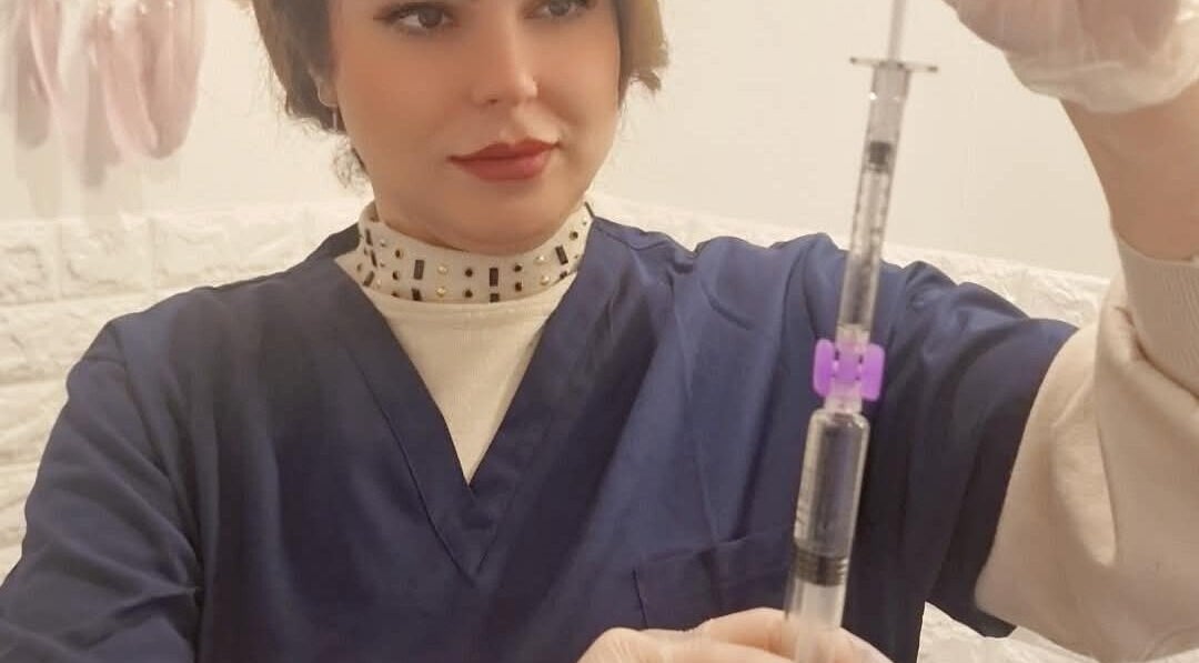 Practitioner preparing treatment at Silk Aesthetic MCR, Salford, England, GB for optimal beauty results.