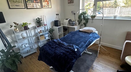 Calming treatment room at Edge Nurse Aesthetics in East Harling, England, GB with cozy bed and soft lighting.