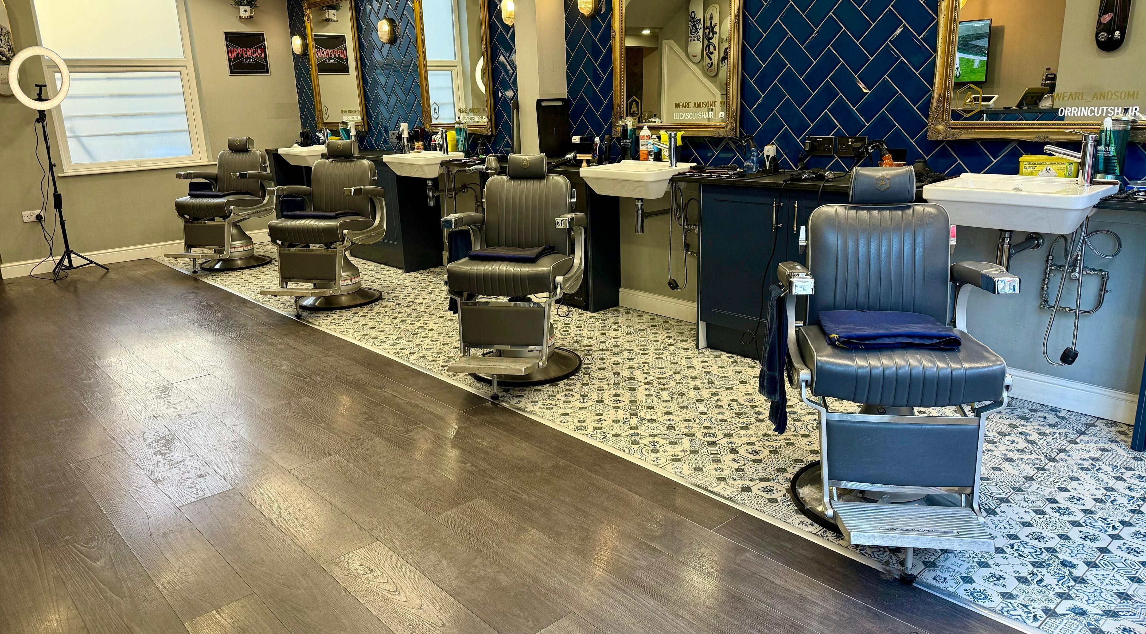 Andsome's sleek barber chairs and decor in Blackpool, England, GB, showcasing modern elegance in grooming.
