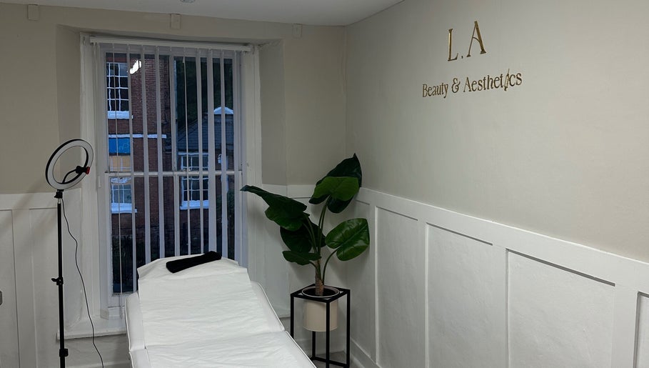 Relaxing treatment room at L.A Beauty & Aesthetics, Dereham, England, GB with chic decor and modern equipment.