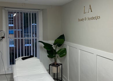 Relaxing treatment room at L.A Beauty & Aesthetics, Dereham, England, GB with chic decor and modern equipment.