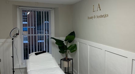Relaxing treatment room at L.A Beauty & Aesthetics, Dereham, England, GB with chic decor and modern equipment.