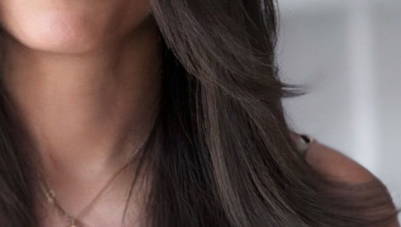 Smooth, sleek hair styled by Sabrina Saeed Hairdesigner in Shelfords, England, GB.