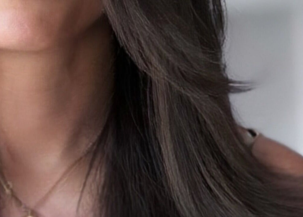 Smooth, sleek hair styled by Sabrina Saeed Hairdesigner in Shelfords, England, GB.