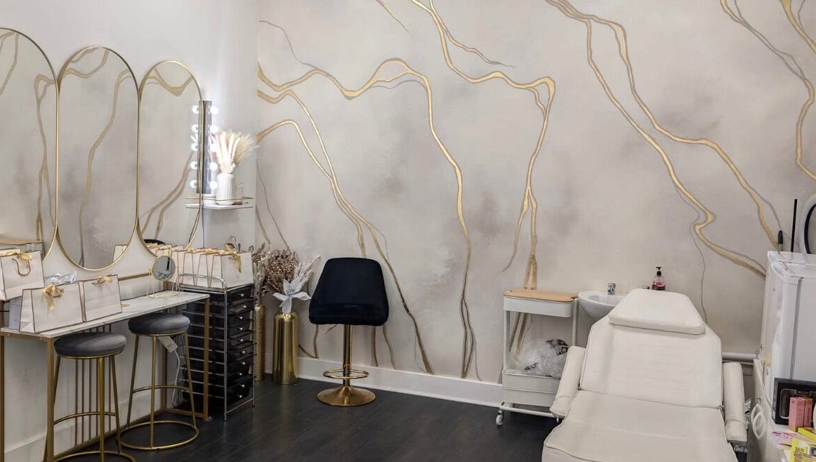 Elegant interior of Lash Lounge Glasgow in Glasgow, Scotland, GB, featuring chic mirrors and plush seating.