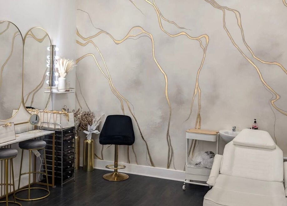 Elegant interior of Lash Lounge Glasgow in Glasgow, Scotland, GB, featuring chic mirrors and plush seating.