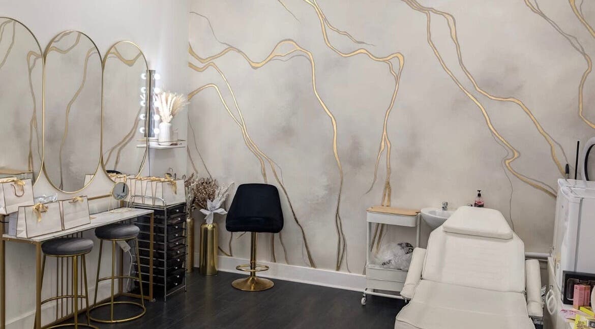 Elegant interior of Lash Lounge Glasgow in Glasgow, Scotland, GB, featuring chic mirrors and plush seating.