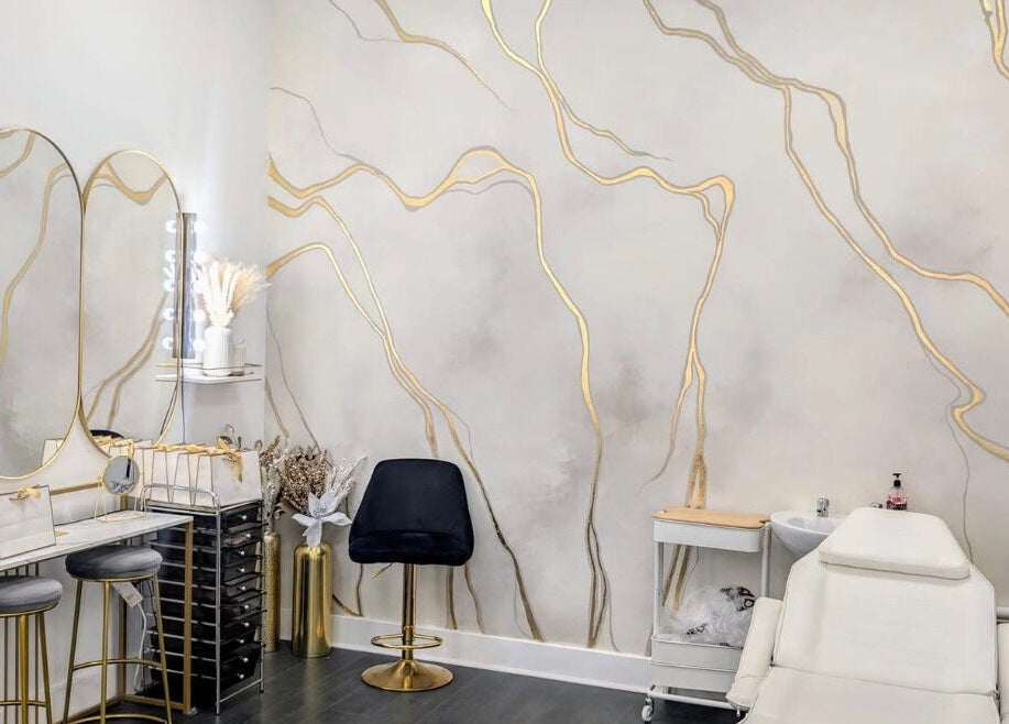 Elegant Lash Lounge Glasgow interior with chic decor, chairs, and treatment bed. Located in Glasgow, Scotland, GB.