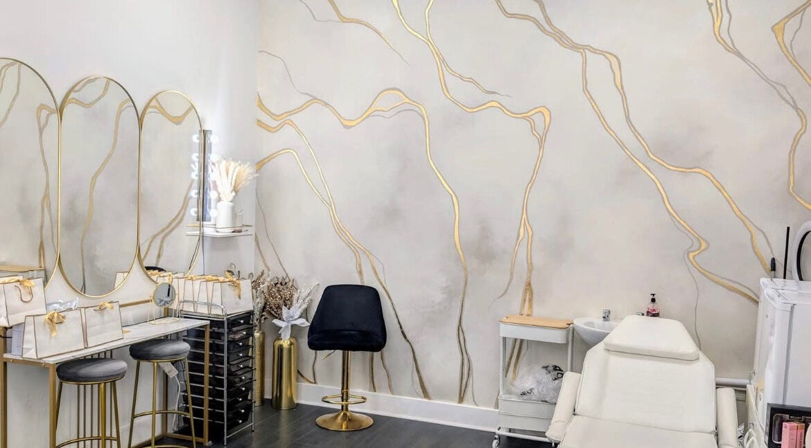 Elegant Lash Lounge Glasgow interior with chic decor, chairs, and treatment bed. Located in Glasgow, Scotland, GB.