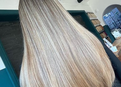 Beautiful long hair at Haute Hair, Cheadle Hulme, England, GB, showcasing smooth, shiny highlights.