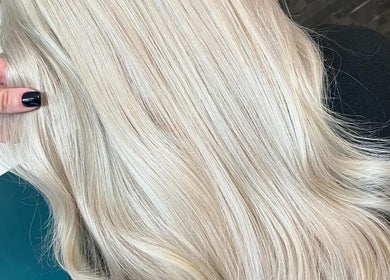Close-up of silky platinum blonde hair at Haute Hair in Cheadle Hulme, England, GB.