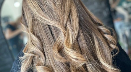 Elegant golden waves hairstyle at Haute Hair in Cheadle Hulme, England, GB, showcasing professional styling.
