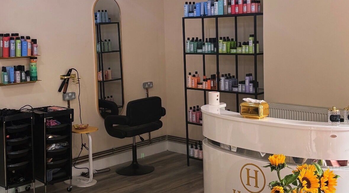 Interior view of Haute Hair in Cheadle Hulme, England, GB showcasing elegant salon styling stations.
