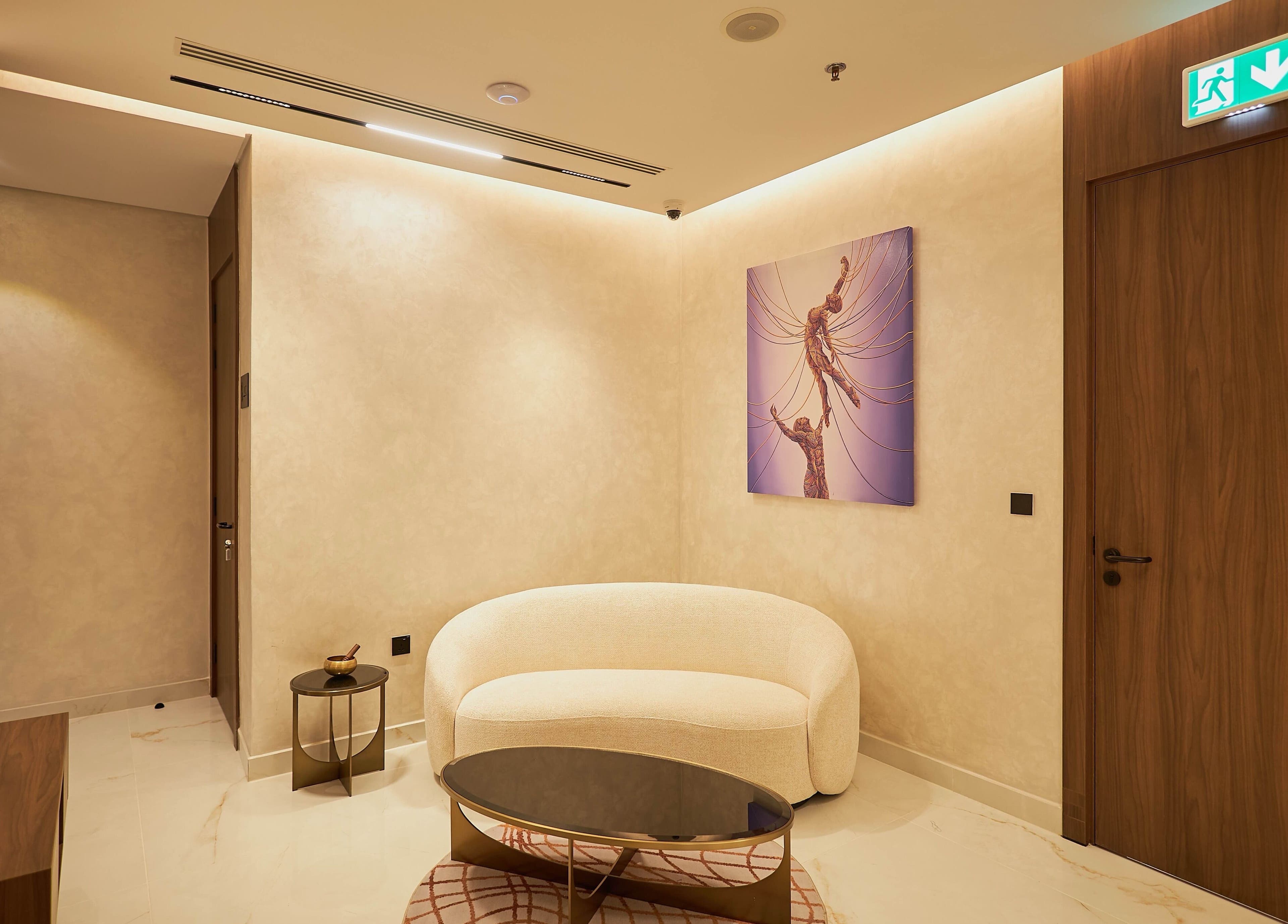 Chic waiting area at The Wheatbaker Spa in Lagos, Lagos, NG featuring modern decor and plush seating.