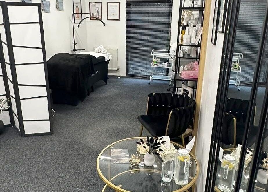 Relaxing interior of Ambers Beauty Studio in Hayle, England, GB with plush chairs and a treatment bed.