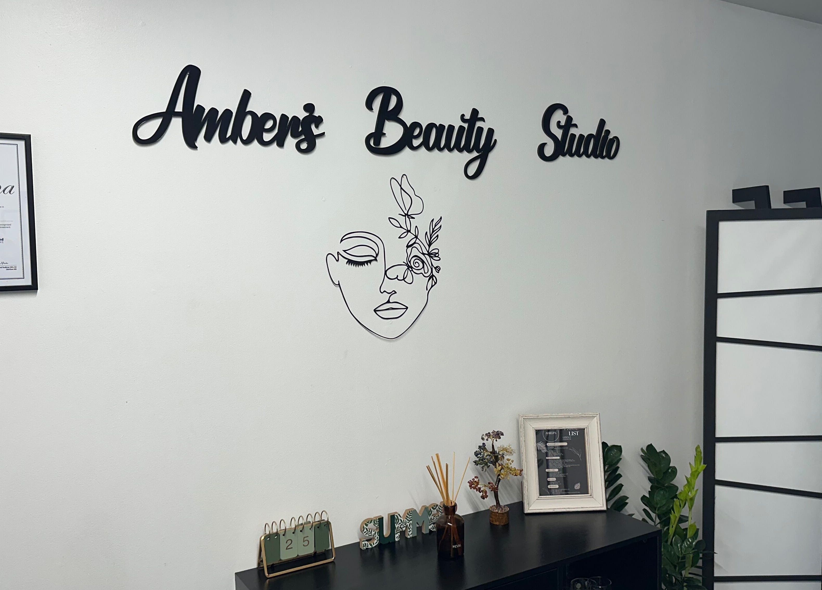 Interior of Ambers Beauty Studio in Hayle, England, featuring decor and diploma on display.