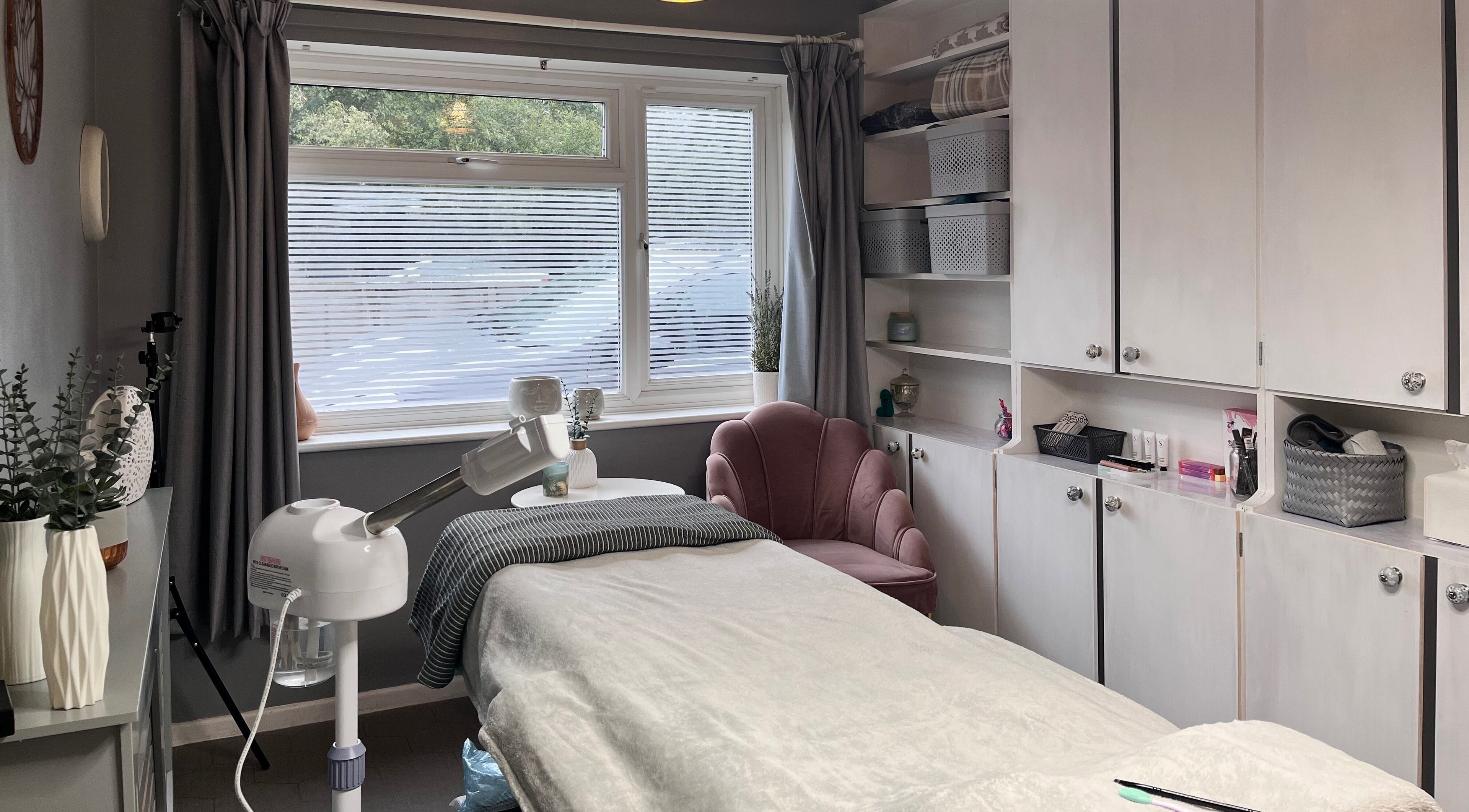 Cozy treatment room at Youphoria Beauty Verwood, Verwood, England, GB with calm decor and comfortable furnishings.