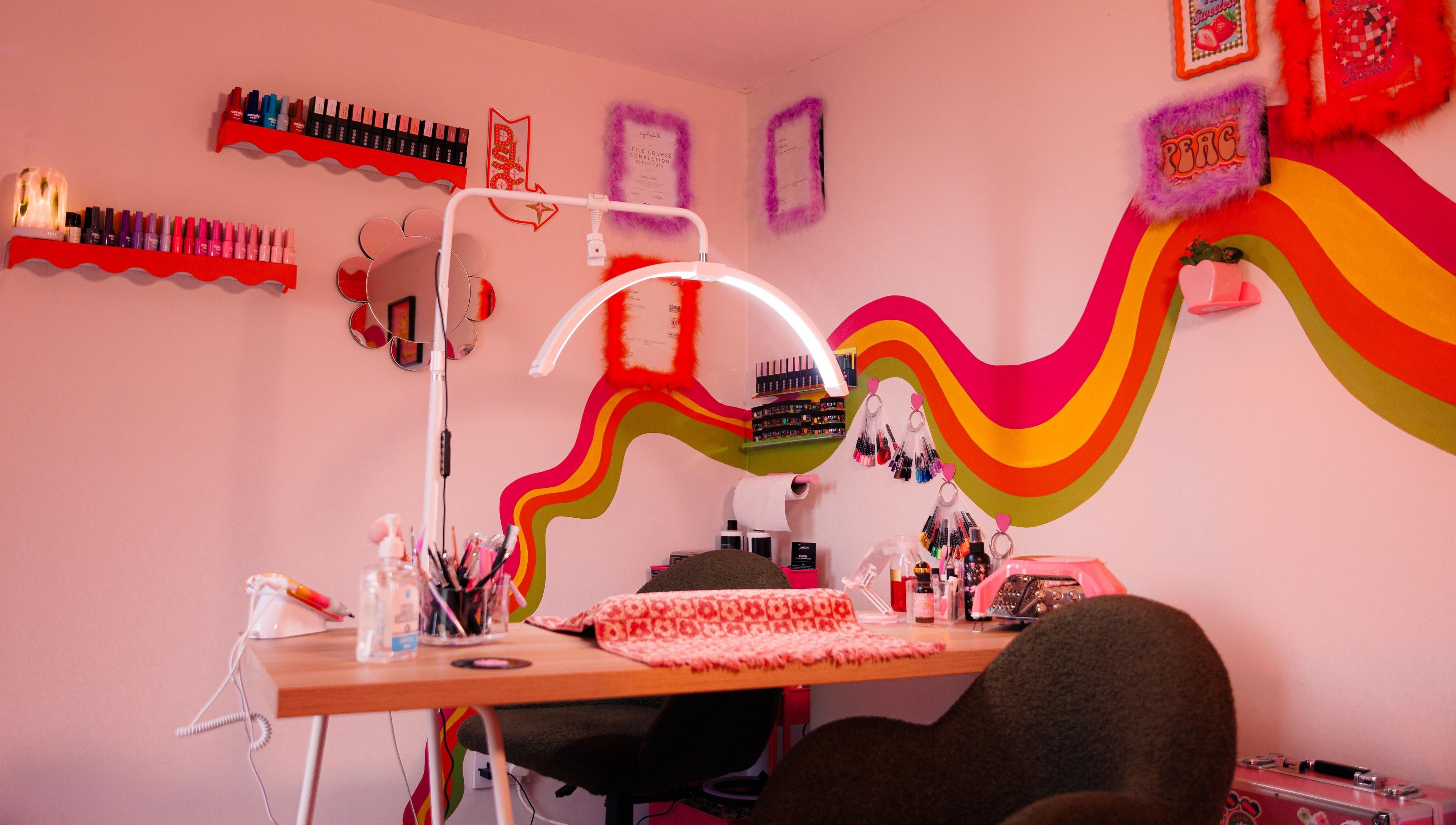 Vibrant nail station at Bobby Dazzler Nails, Winlaton, England, GB with colorful decor and manicure tools.