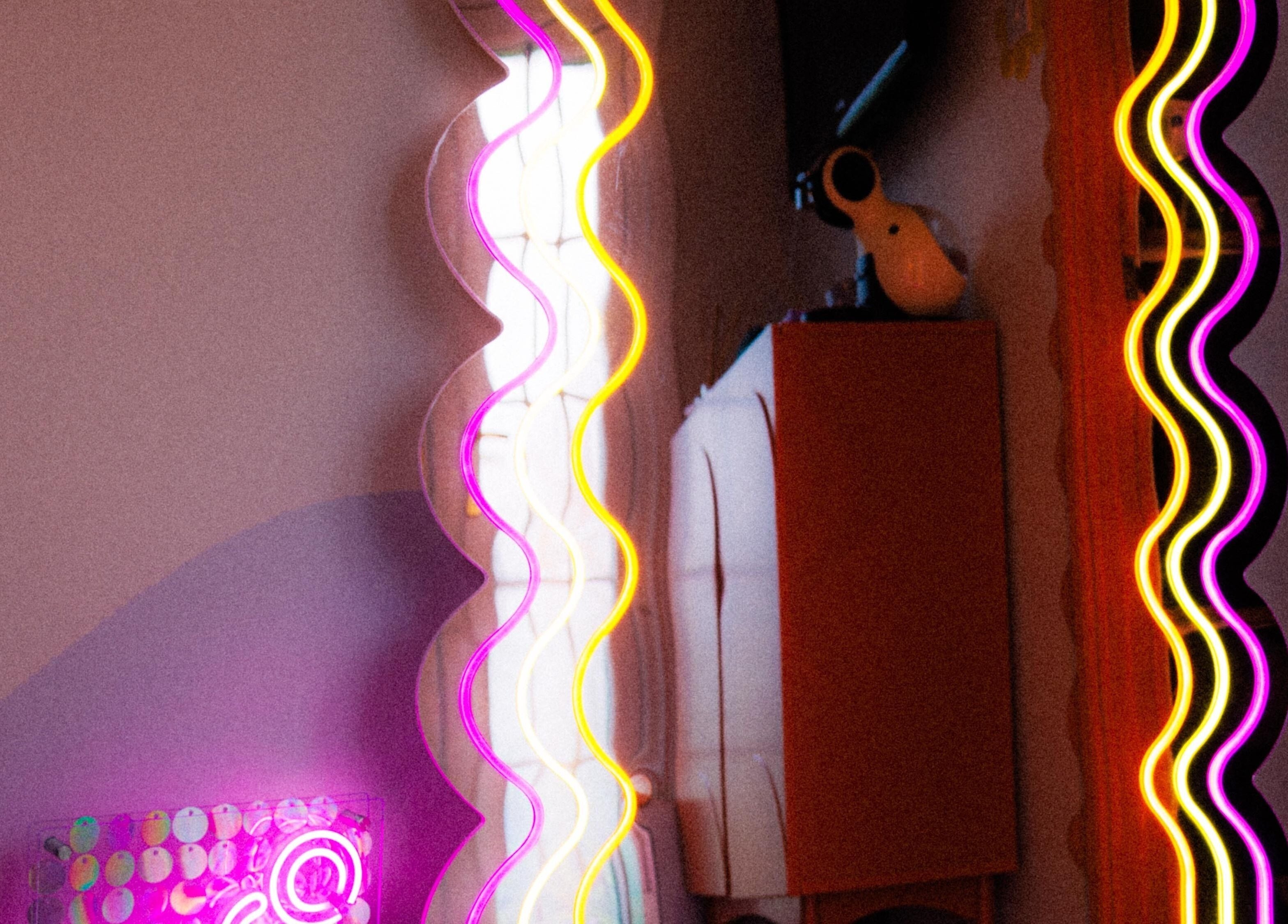 Vibrant neon lights at Bobby Dazzler Nails in Winlaton, England, GB, creating a lively and colorful ambiance.