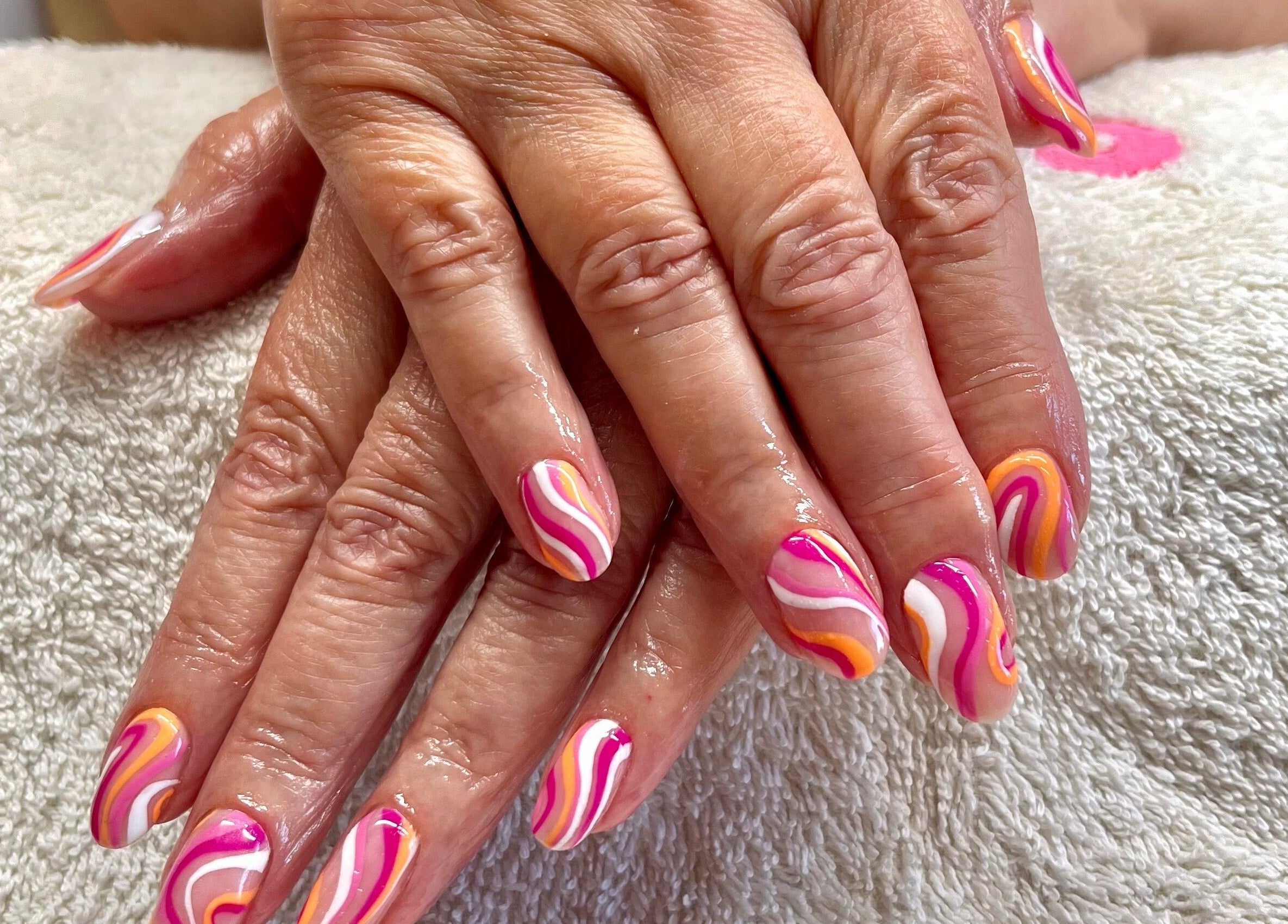 Colorful swirl nail art at Bobby Dazzler Nails in Winlaton, England, GB.