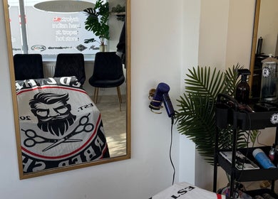 Interior of Redz Hedz Barbers in Goldthorpe, England, showing a well-equipped styling station.