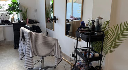 Contemporary barber station at Redz Hedz Barbers in Goldthorpe, England with sleek mirrors and styling tools.