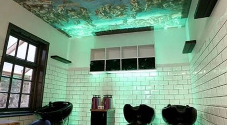 Washtub area with artistic ceiling at Lou Aldwick hair, Bognor Regis, England, GB.