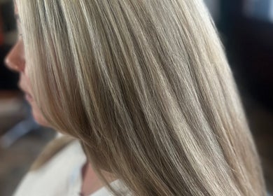 Sleek blonde hair styled at Lou Aldwick hair in Bognor Regis, England, GB salon.