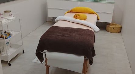 A tranquil massage table in Beauty By Bev, Maputo, Maputo, MZ, ready for a relaxing spa experience.