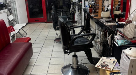 Interior of TEDDYBARBERS in London, England, GB with modern chairs and sleek decor.