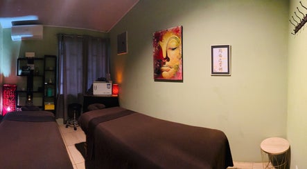 Cozy massage room at Sunset Body Works in Uvita, Provincia De Puntarenas, CR with calming decor.