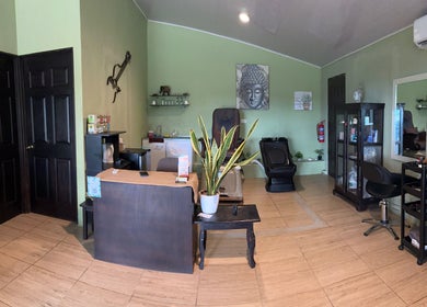 Relaxing interior of Sunset Body Works, Uvita, Provincia De Puntarenas, CR with massage chairs and calming decor.