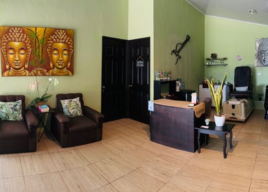 Relaxing spa seating area at Sunset Body Works in Uvita, Provincia De Puntarenas, CR with Buddha decor.