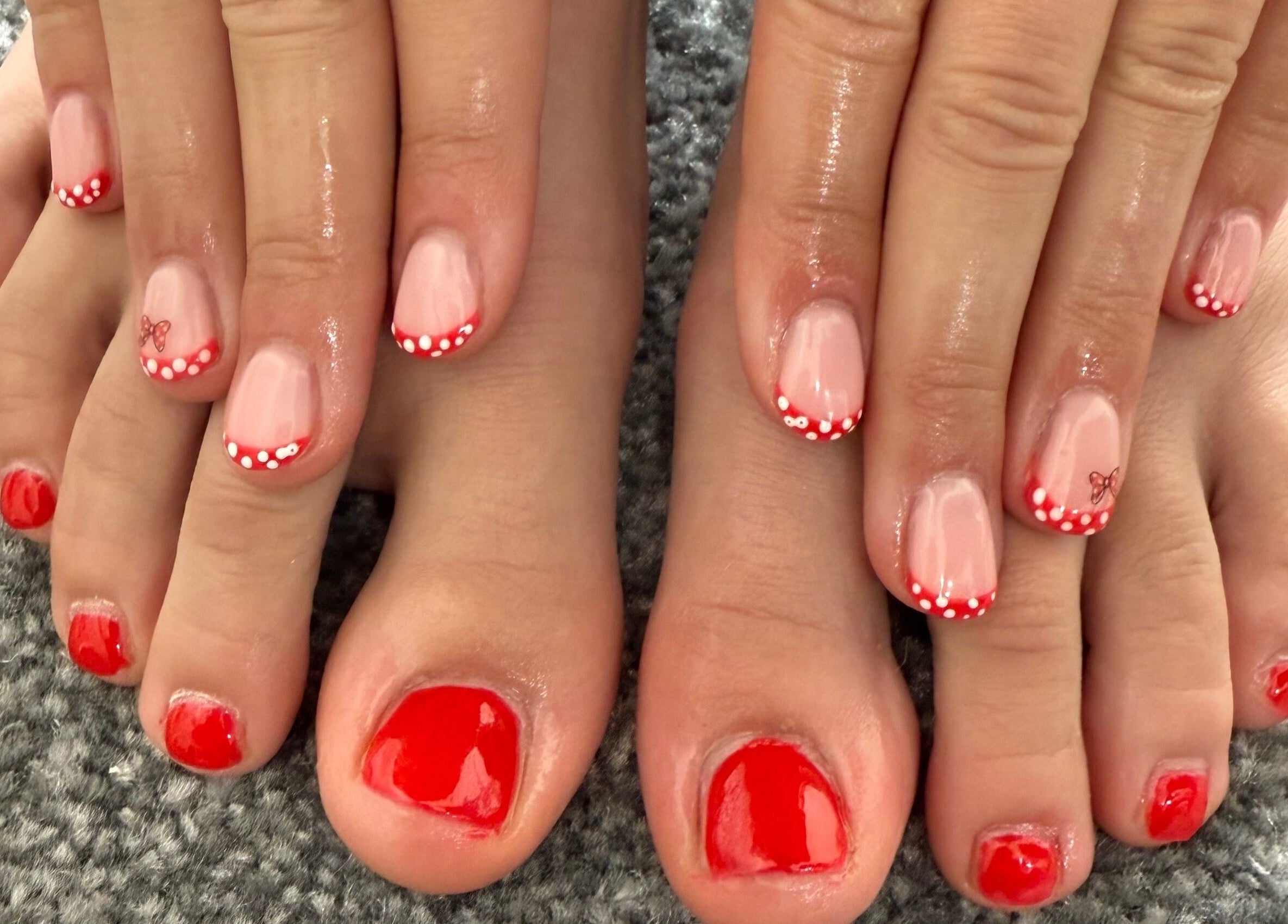 Elegant red nails with polka dots by Jewels Not Tools by Amy in Newton Mearns, Scotland, GB.