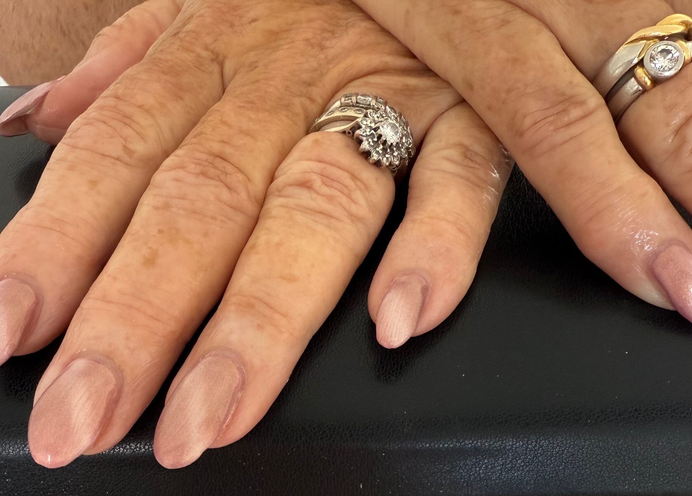 Polished nails with rings at Jewels Not Tools by Amy in Newton Mearns, Scotland, GB.