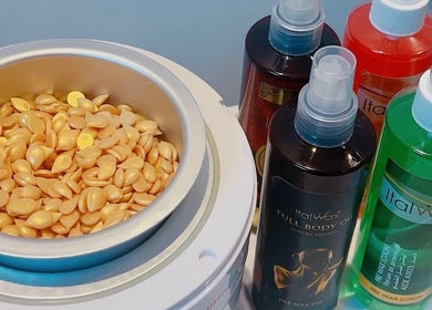 Waxing supplies at Brazil Waxing Woodside Park, London, England, GB showcasing wax beads and lotions.