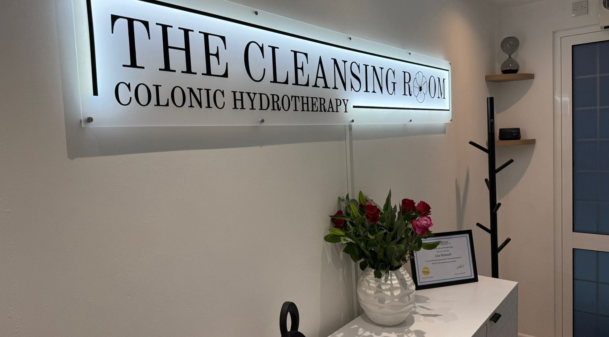 Elegant interior of The Cleansing Room with flowers in Bordon, England, GB, highlighting colonic hydrotherapy.