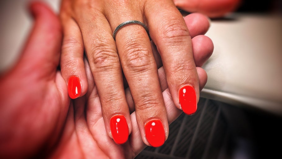 Bright red manicure at Freedombeauty, Plymouth, England, GB, showcasing elegant nail care service.