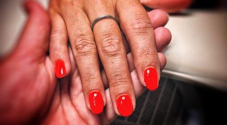 Bright red manicure at Freedombeauty, Plymouth, England, GB, showcasing elegant nail care service.