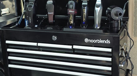 A neatly organized grooming toolbox at Noor Blends, London, England, GB showcasing professional hair tools.